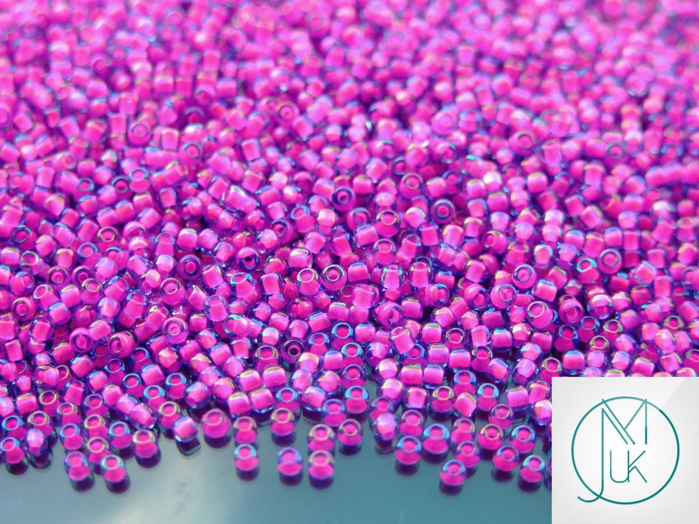 Wholesale TOHO Beads 980 Luminous Light Sapphire Neon Pink Lined 11/0 beads mouse