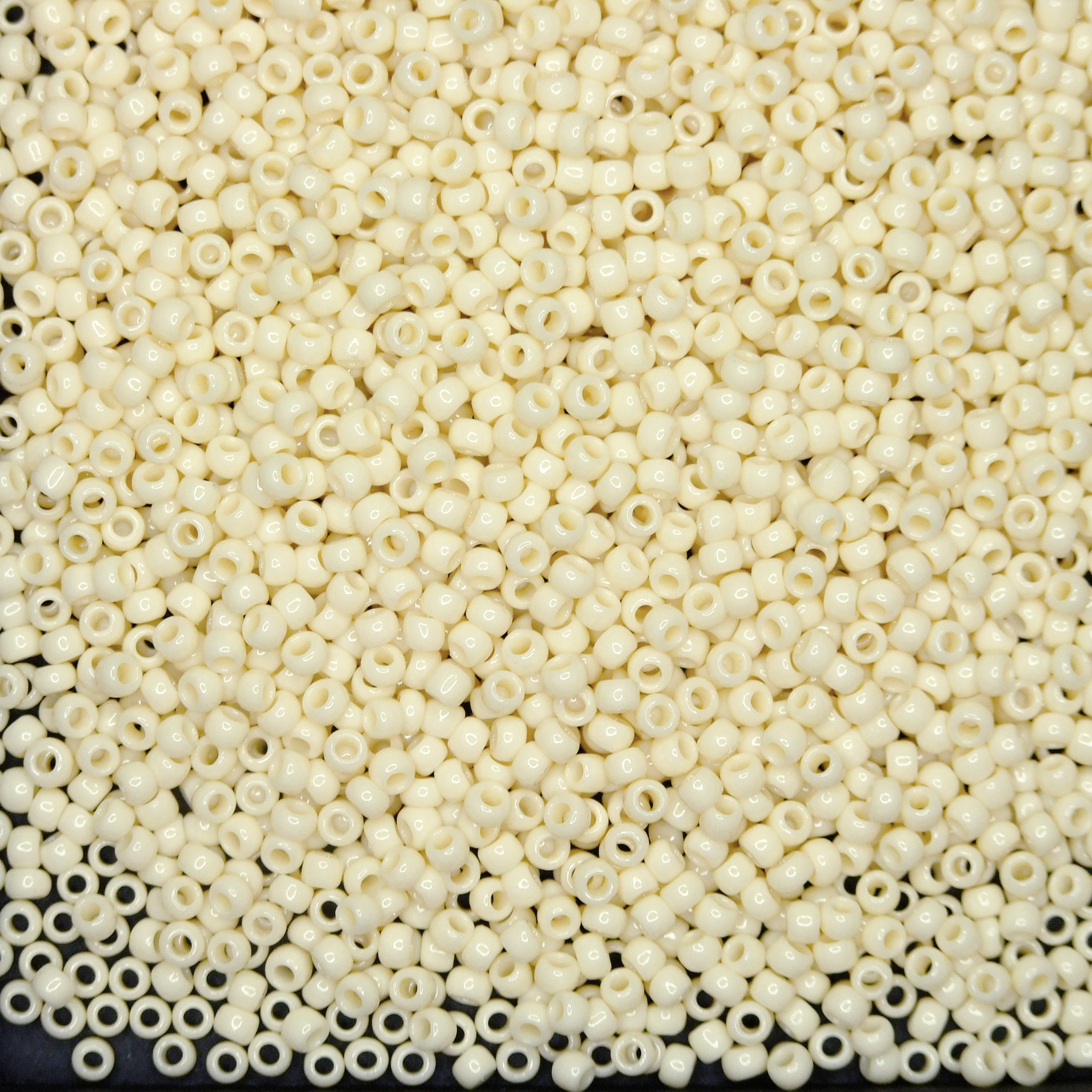 TOHO Seed Beads 51 Opaque Light Beige beads mouse