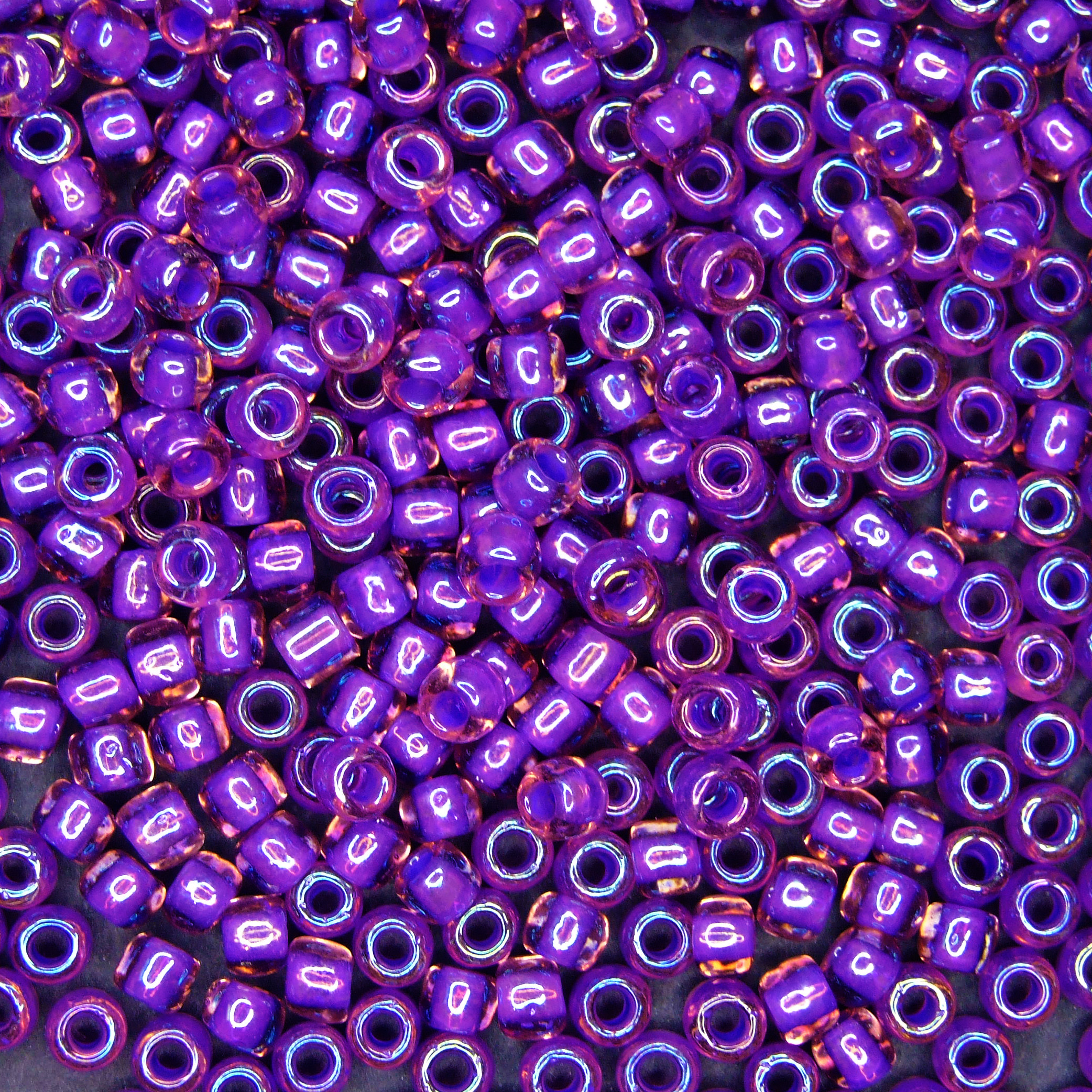 TOHO Seed Beads 928 Inside Color Rainbow Rosaline Purple Lined beads mouse