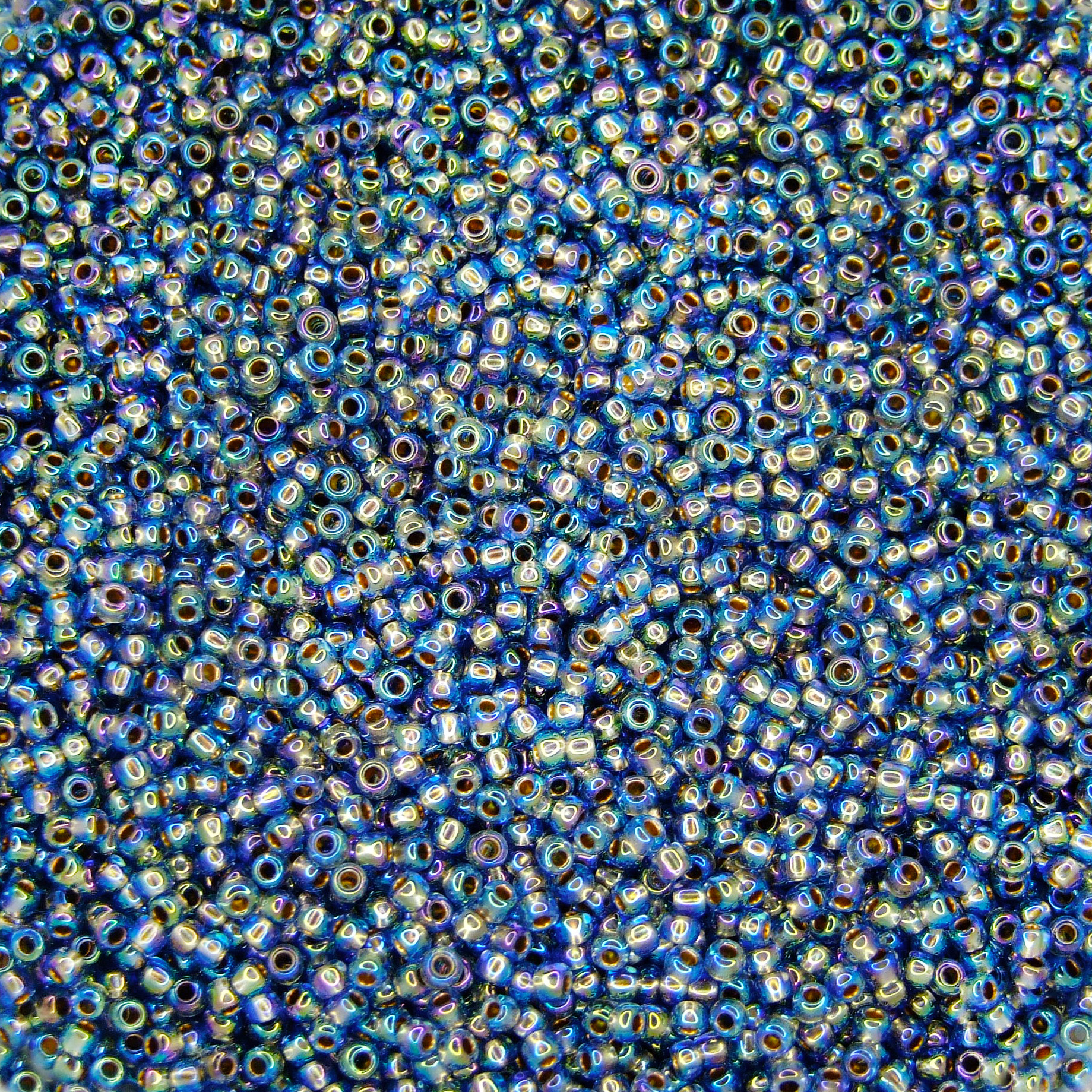TOHO Seed Beads 997 Gold Lined Rainbow Light Sapphire beadsmouse.co.uk